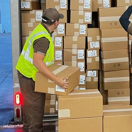 Orders being loaded onto a carrier truck
