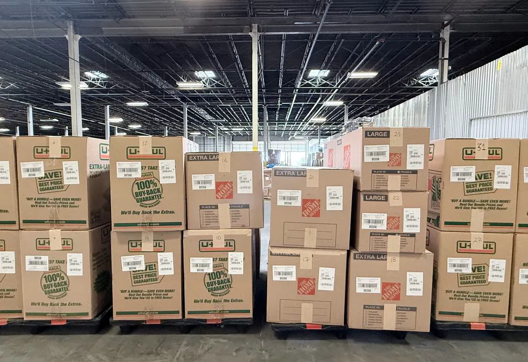 Cartons with FBA labels, stacked on pallets